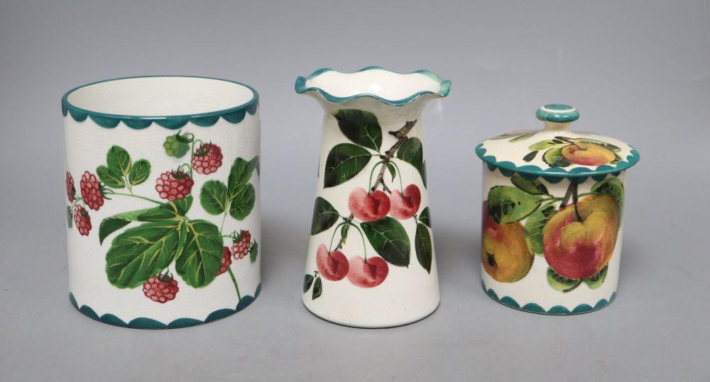 A Wemyss lidded jam pot, a vase decorated with strawberries and another fluted vase decorated with cherries, fluted vase, H13.5cm